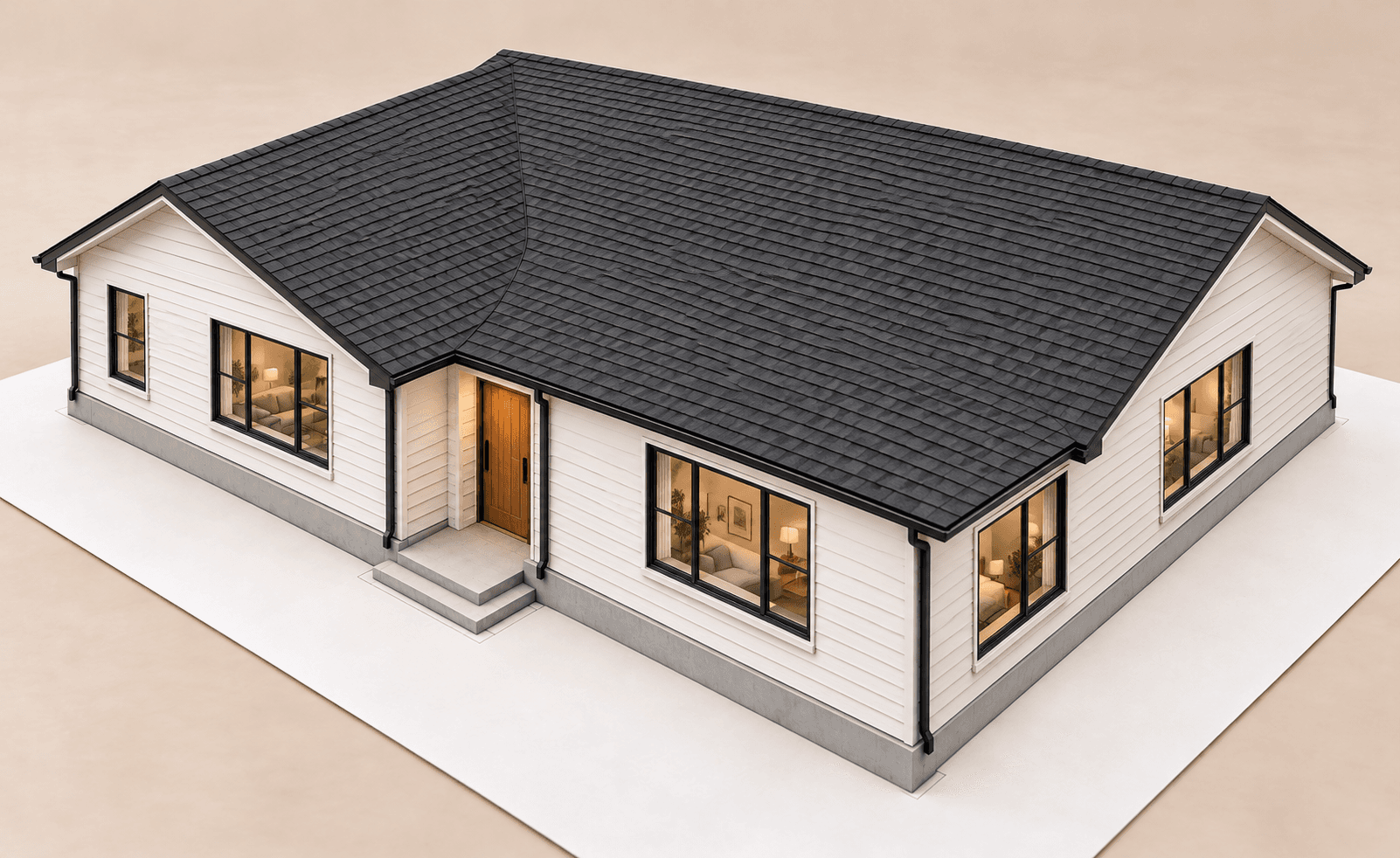 Completed single-storey house with light siding and a dark roof viewed from the same front corner.